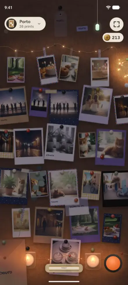 The Porto board in Corkie: 26 prints on cork under fairy lights, with candles along the bottom
